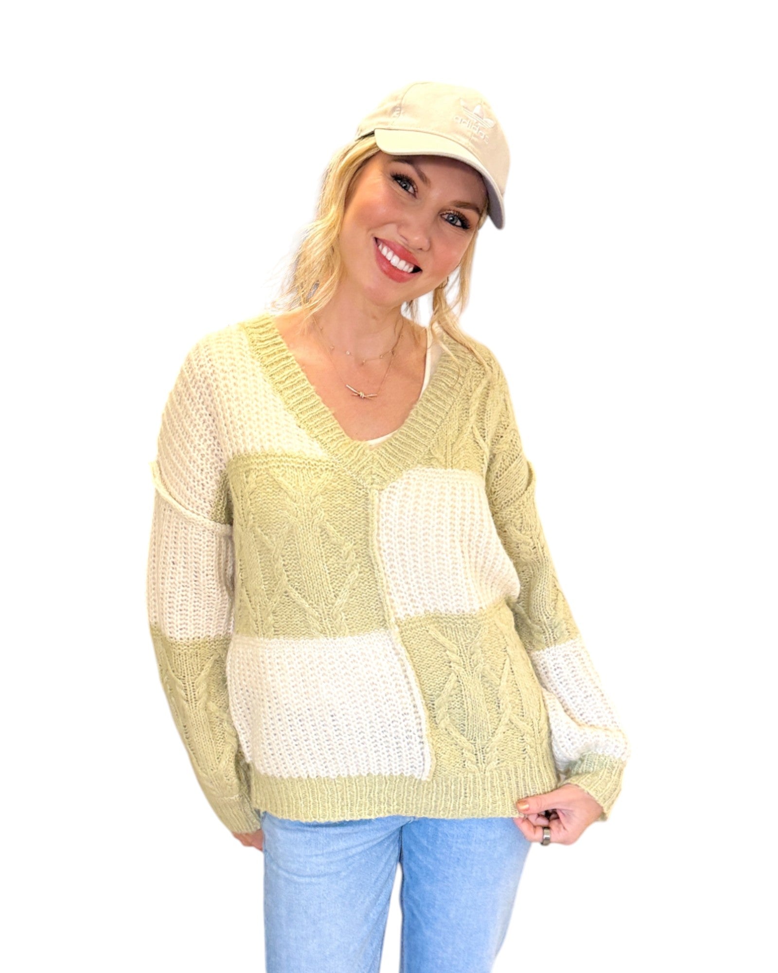 Super Soft Light Sage and Cream Color Block Sweater with a V-neckline, long sleeves, and a relaxed fit in soft knit fabric, perfect for layering or standalone wear.