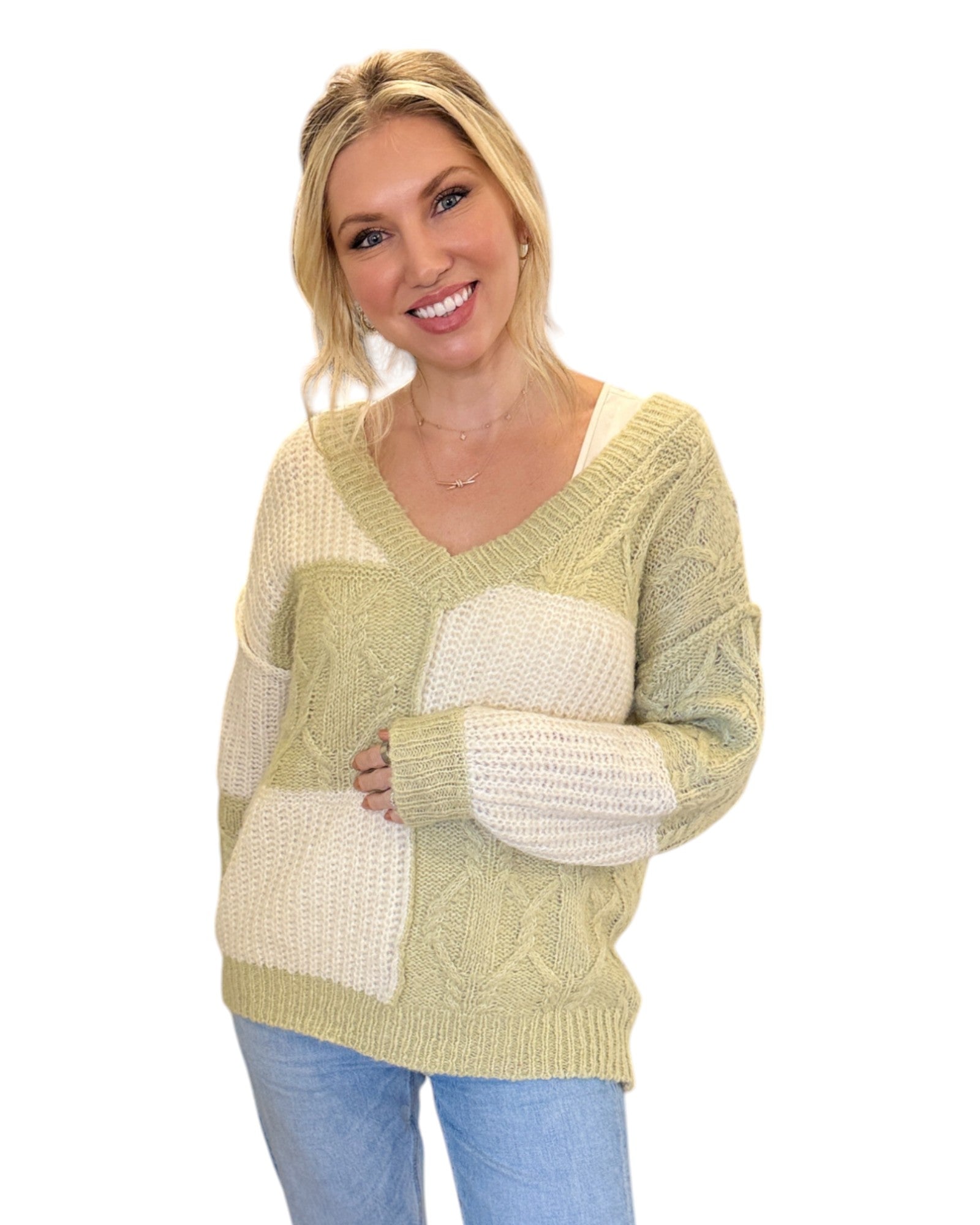 Super Soft Light Sage and Cream Color Block Sweater with a V-neckline, long sleeves, and a relaxed fit in soft knit fabric, perfect for layering or standalone wear.
