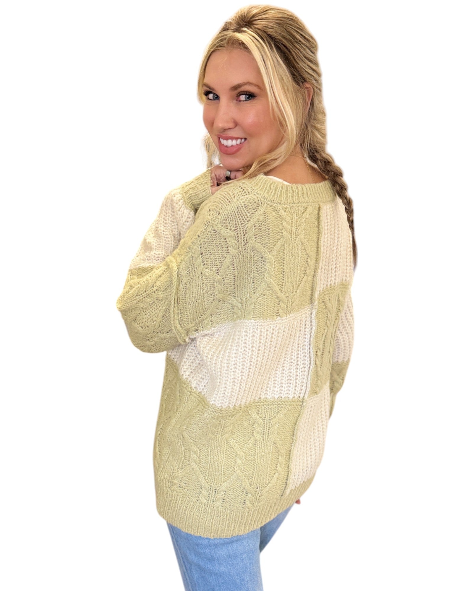 Super Soft Light Sage and Cream Color Block Sweater with a V-neckline, long sleeves, and a relaxed fit in soft knit fabric, perfect for layering or standalone wear.
