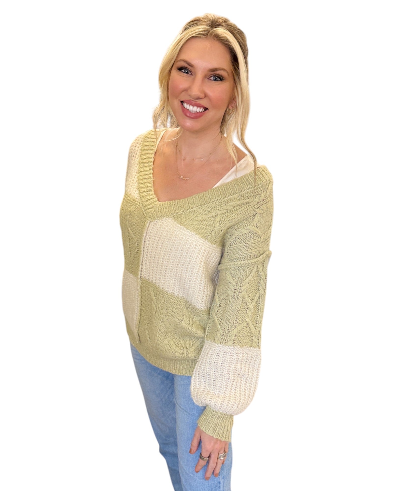 Super Soft Light Sage and Cream Color Block Sweater with a V-neckline, long sleeves, and a relaxed fit in soft knit fabric, perfect for layering or standalone wear.