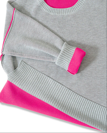 Gray sweater with pink contrast trim on a white background.