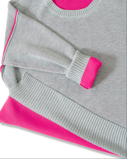 Gray sweater with pink contrast trim on a white background.