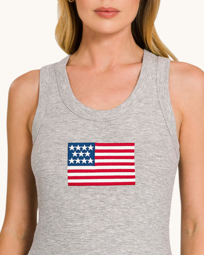 Gray tank top with American flag design worn by a person.