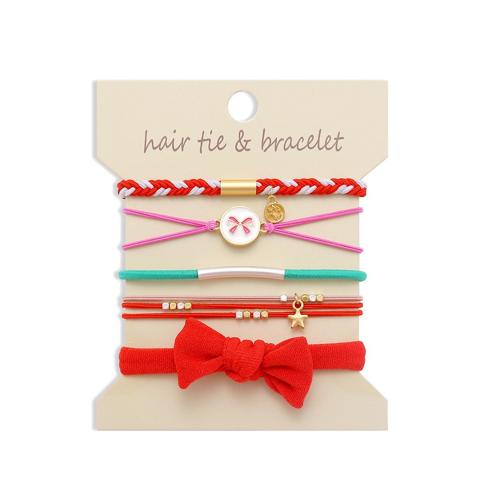 Set of hair ties and bracelets on a beige card with product name.