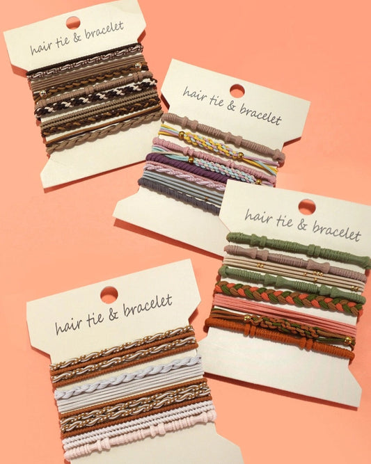 Set of hair tie and bracelet sets on display cards against a light peach background.