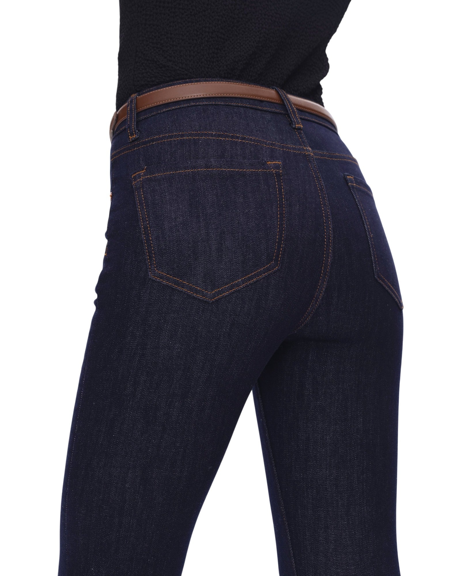 Dark blue jeans with a brown belt on a white background
