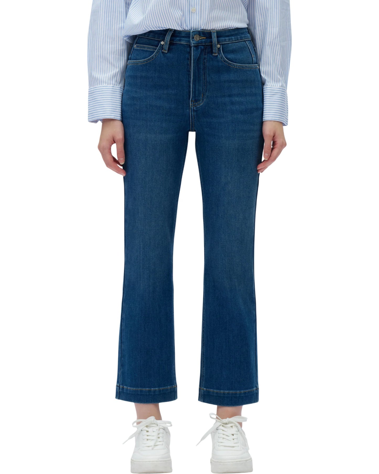 Person wearing blue jeans and a striped shirt on a white background.