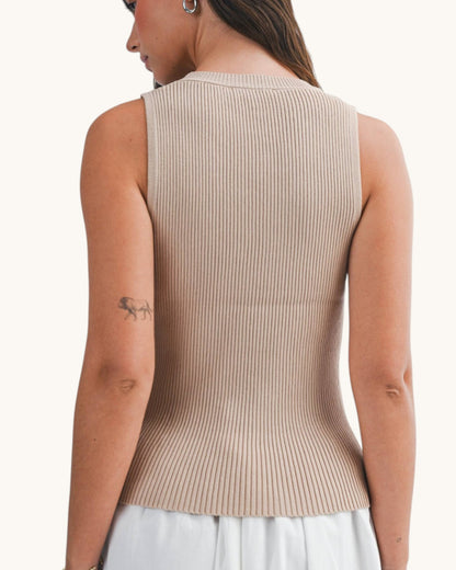 Back view of a woman wearing an Oat round neck ribbed sleeveless top.