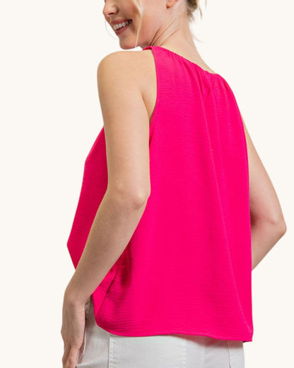Hot pink sleeveless top with ruched neckline, back view.
