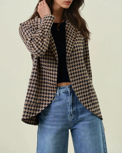 Woman wearing a Houndstooth Shawl Blazer Black and Mocha with open front and modern collar.