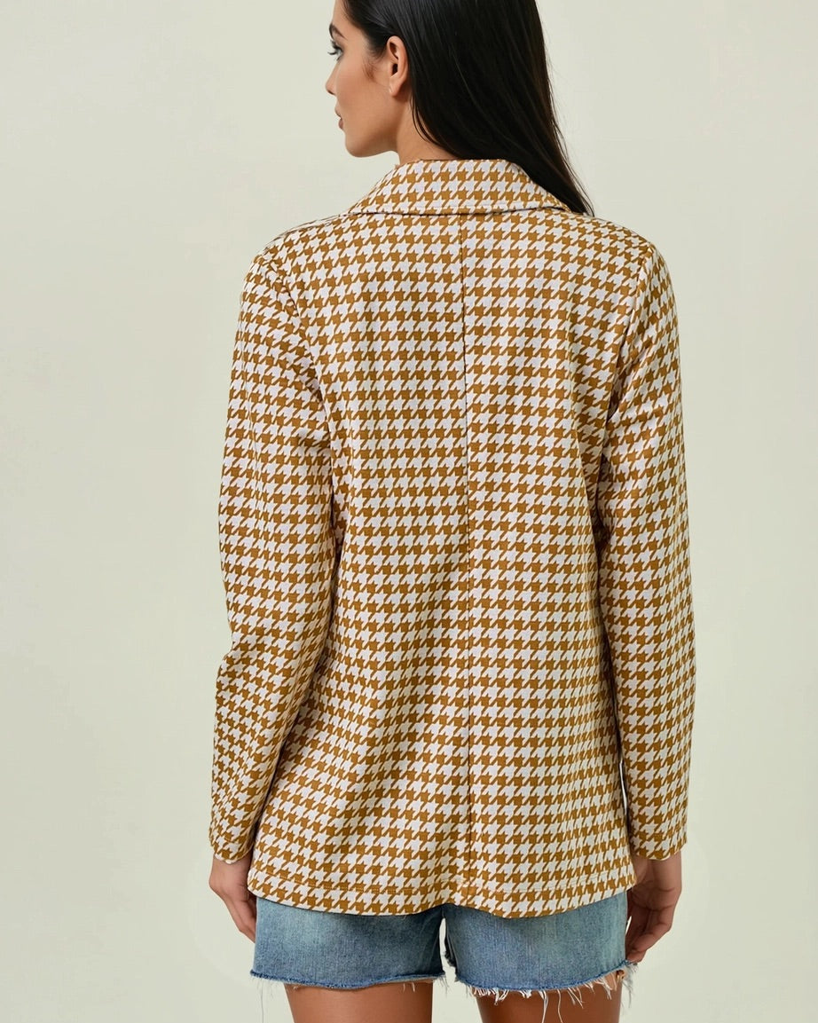 Woman wearing the Houndstooth Shawl Blazer in Ivory and Marigold with open front and modern collar.