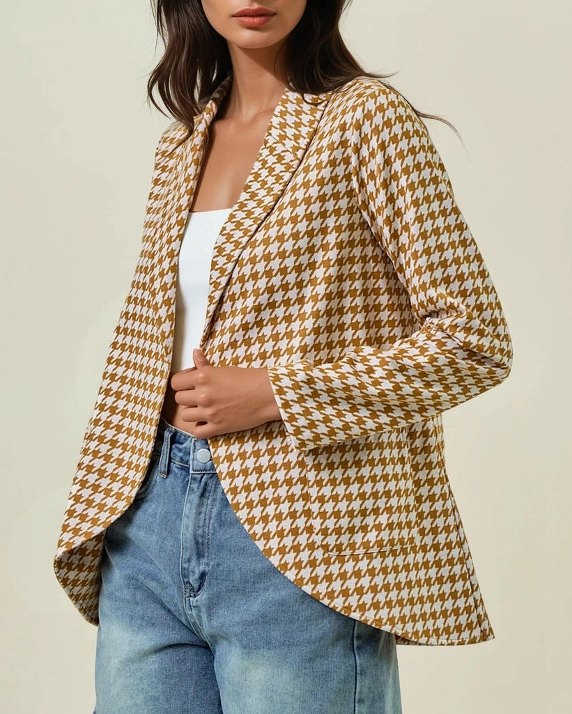 Woman wearing the Houndstooth Shawl Blazer in Ivory and Marigold with open front and modern collar. 