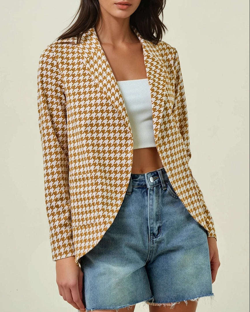 Woman wearing the Houndstooth Shawl Blazer in Ivory and Marigold with open front and modern collar.