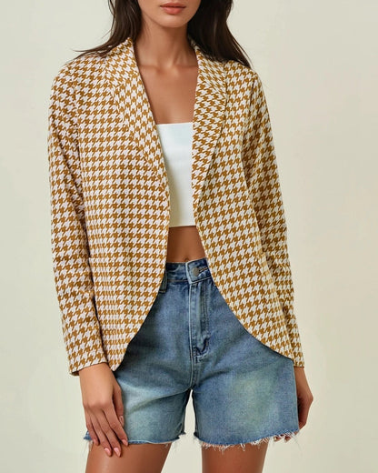 Woman wearing the Houndstooth Shawl Blazer in Ivory and Marigold with open front and modern collar.