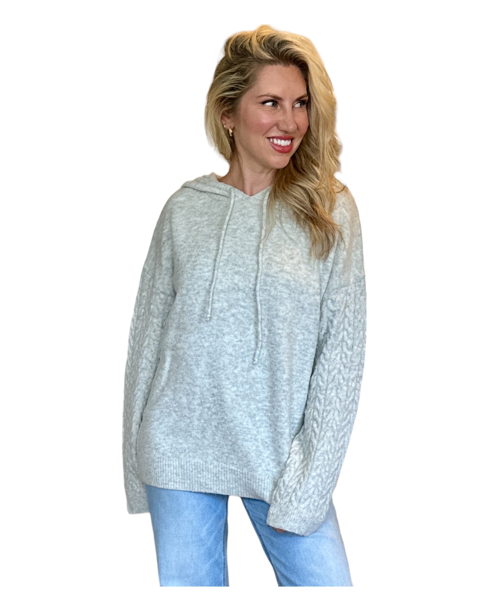 Model wearing an Antique Rose Women's Hoodie featuring wide cable-knit braided sleeves, a cozy marled sweater knit bodice, and an oversized fit.