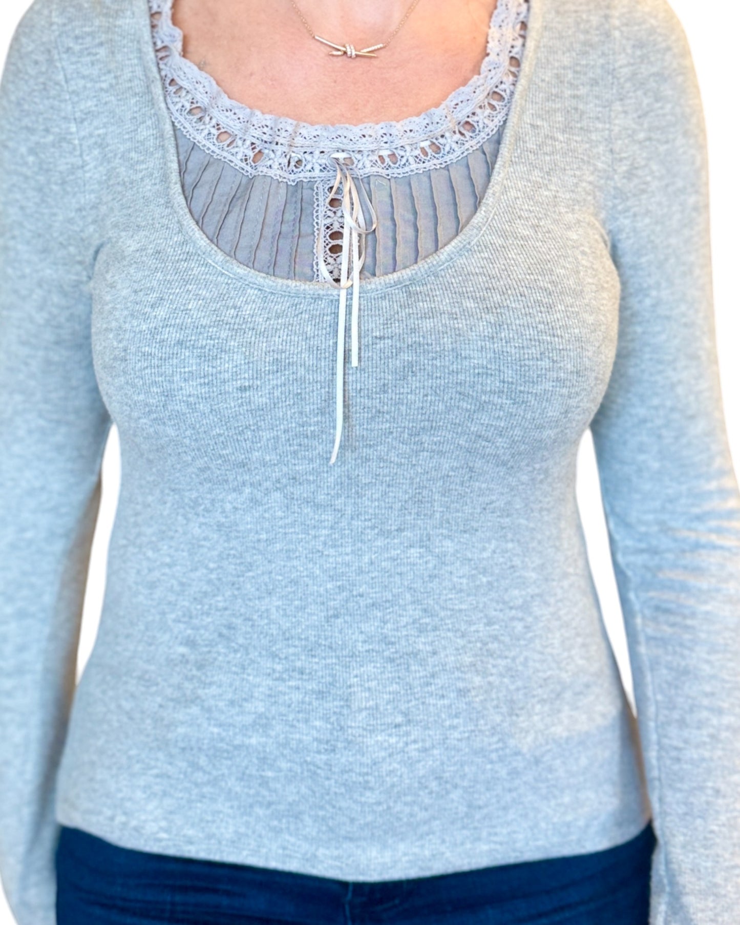 Grey soft ribbed long sleeve top with lace tie accent.