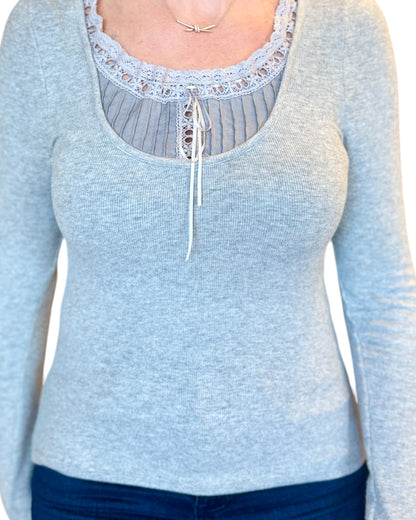 Grey soft ribbed long sleeve top with lace tie accent.