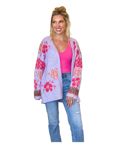 Fuzzy lavender floral cardigan with oversized fit and open front for a whimsical yet chic look.