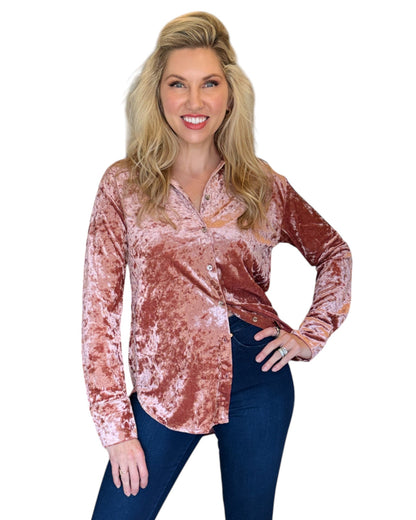 Woman wearing a Winter Rose Button-Down Velvet Shirt with a flattering, relaxed fit and button-front detail, perfect for holiday gatherings or a chic night out.
