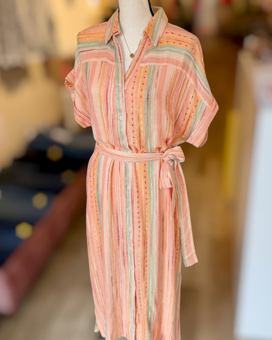 Striped dress on a mannequin with a blurred background