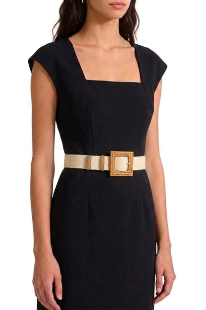 Woman in white dress wearing the Ivory Wanderlust Boho Adjustable Buckle Belt.