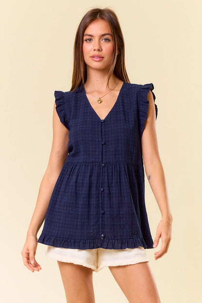 Navy gingham sleeveless tank top with ruffle trim and babydoll silhouette.
