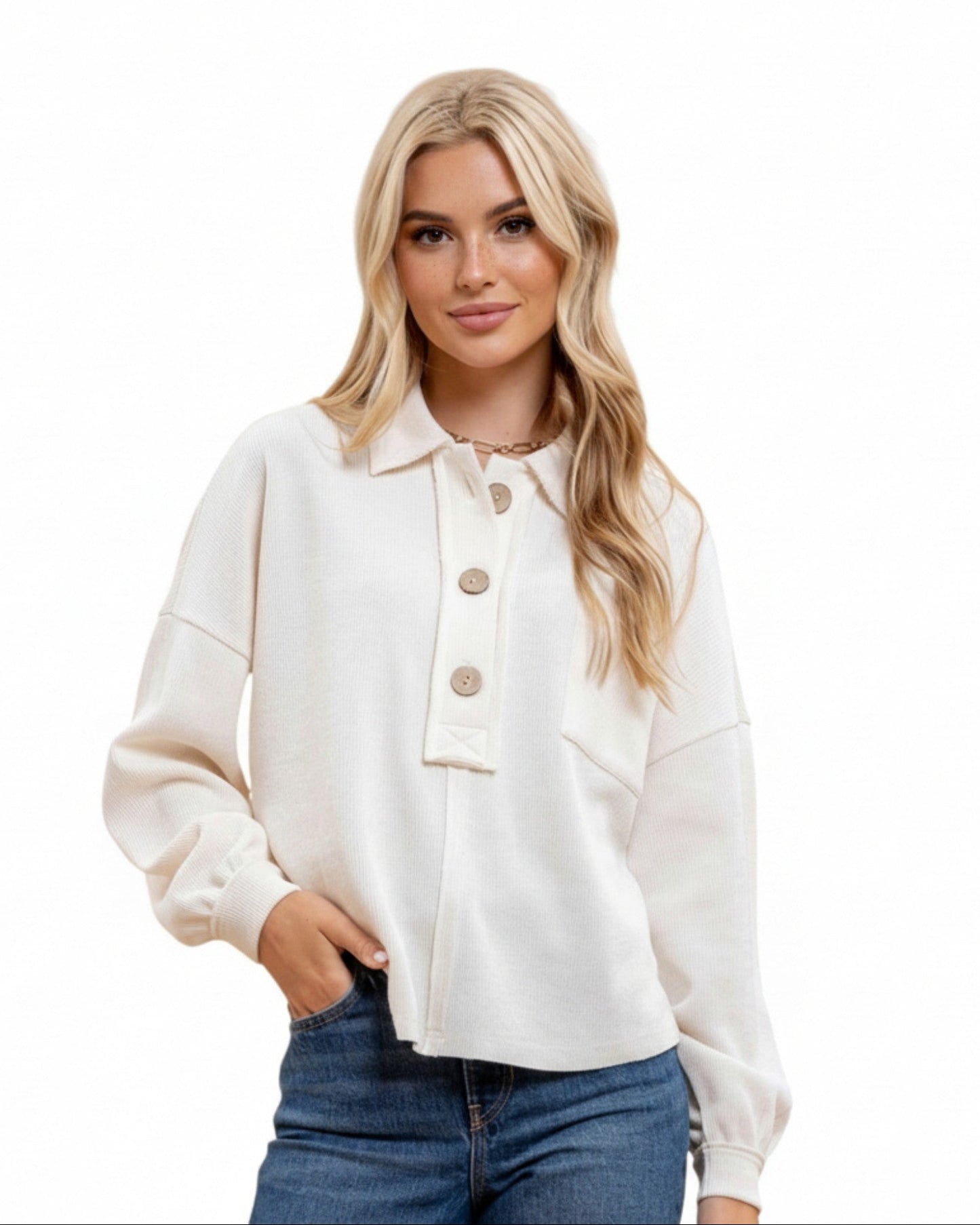 Woman wearing a white casual ribbed top with a collar and oversized buttons on a white background.