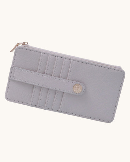 Ivory wallet with a zipper on a white background.