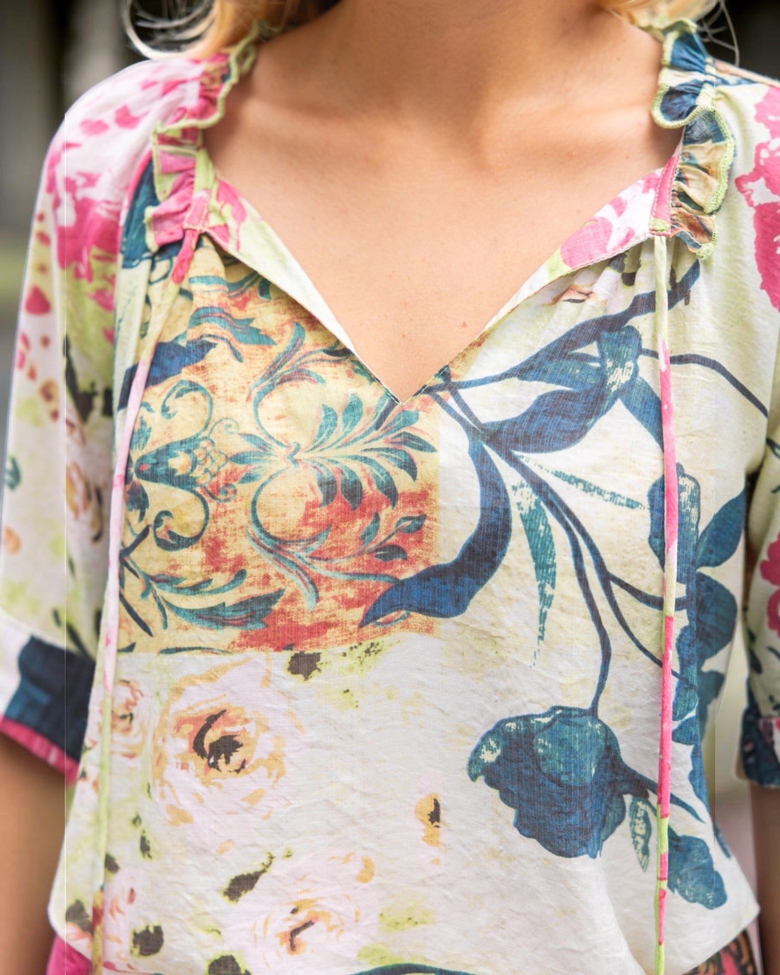 Close-up of a colorful  tie front floral-patterned garment.