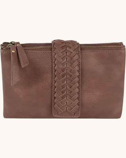 Brown leather clutch with braided strap on a white background.