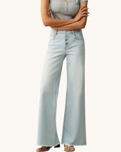Light blue jeans worn by a person on a white background