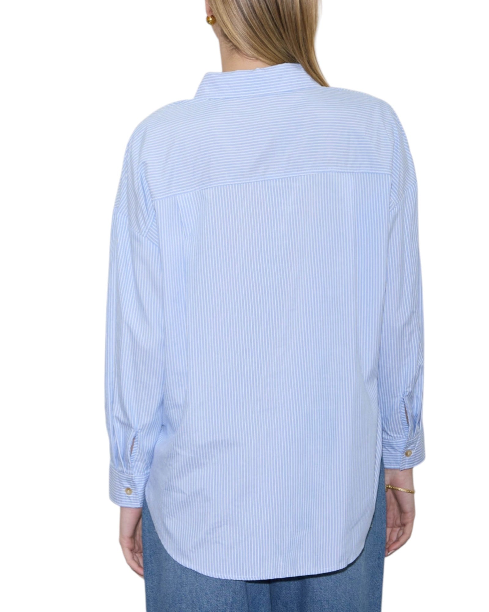Light blue striped shirt worn by a person on a white background.