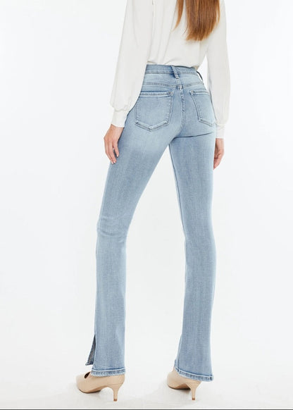 Kan Can Mid-Rise Split Hem Medium Wash Bootcut Jeans with flattering fit and side slit hem.