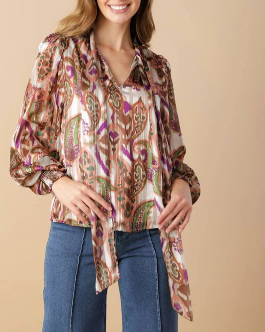Multi-color paisley tie neck blouse with smocked cuffs.