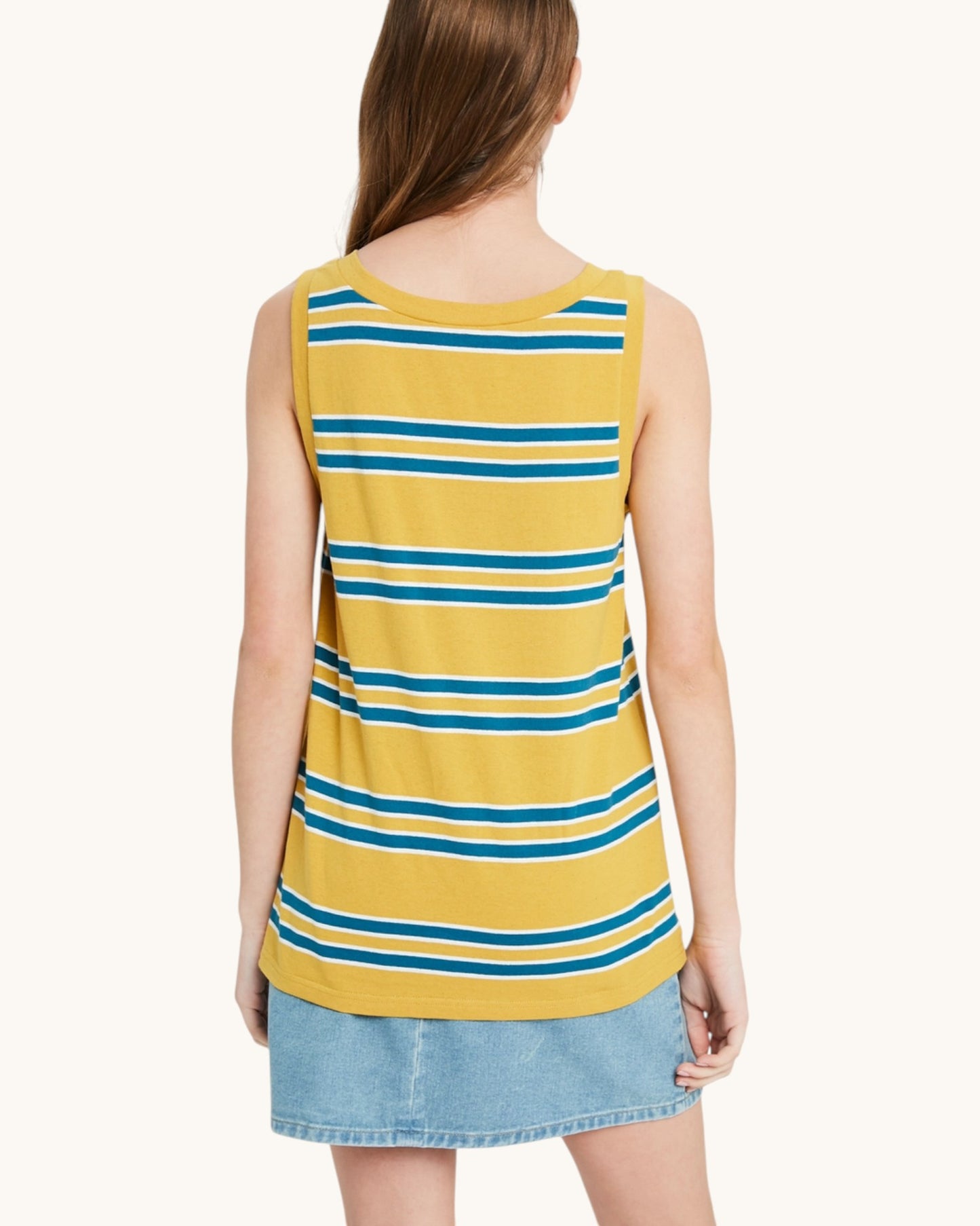 Back view of a yellow and blue striped sleeveless top worn by a person on a white background.