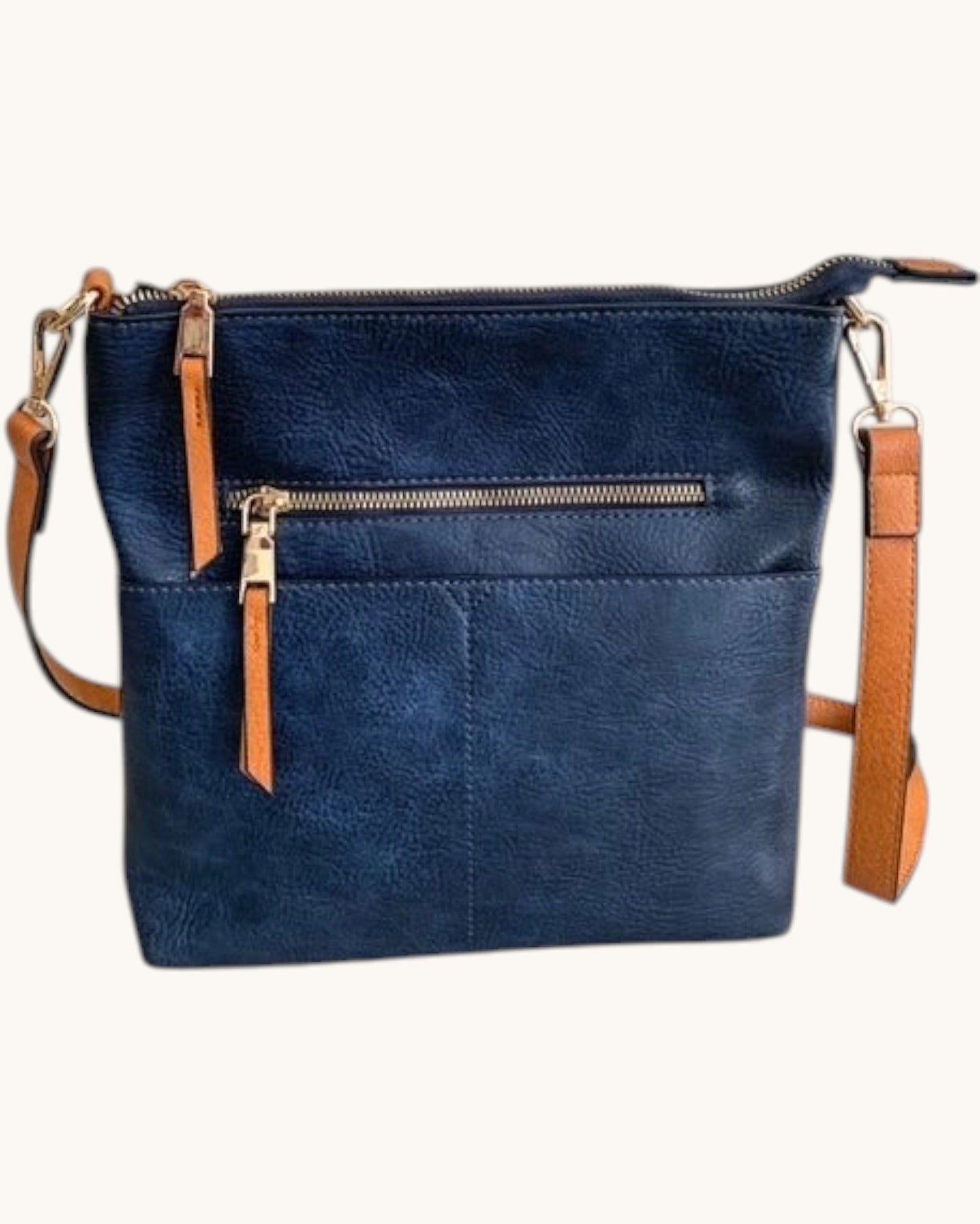 Navy handbag with brown straps on a white background.