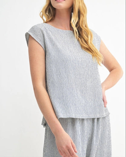  Navy sleeveless top with heathered texture and modern cut. 