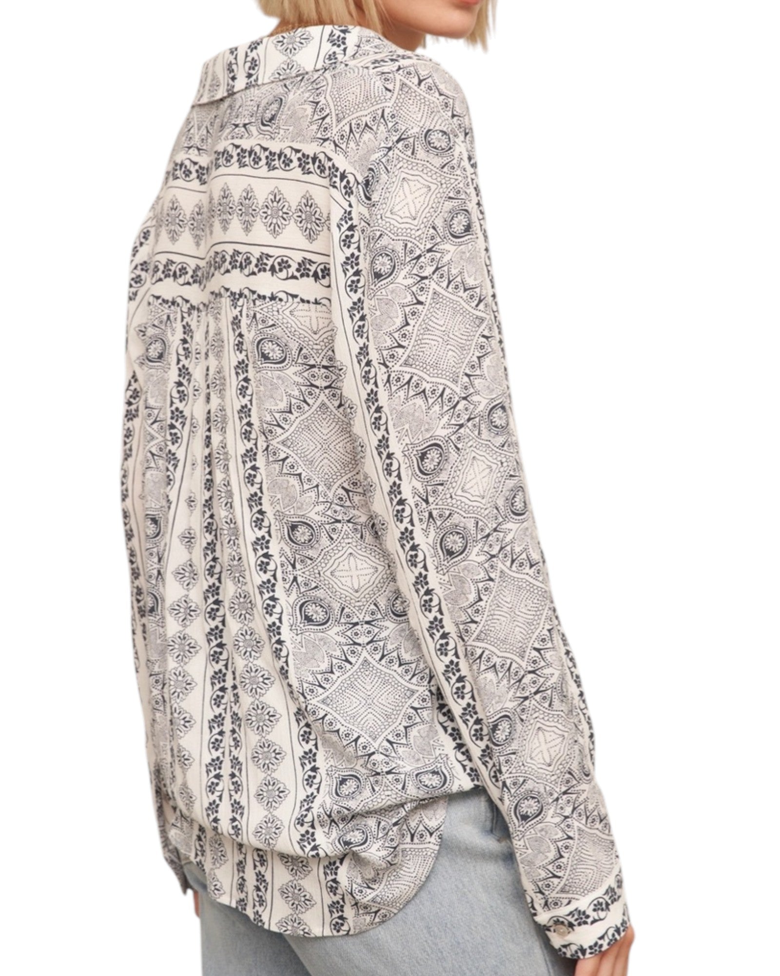 Patterned shirt worn by a person on a white background.