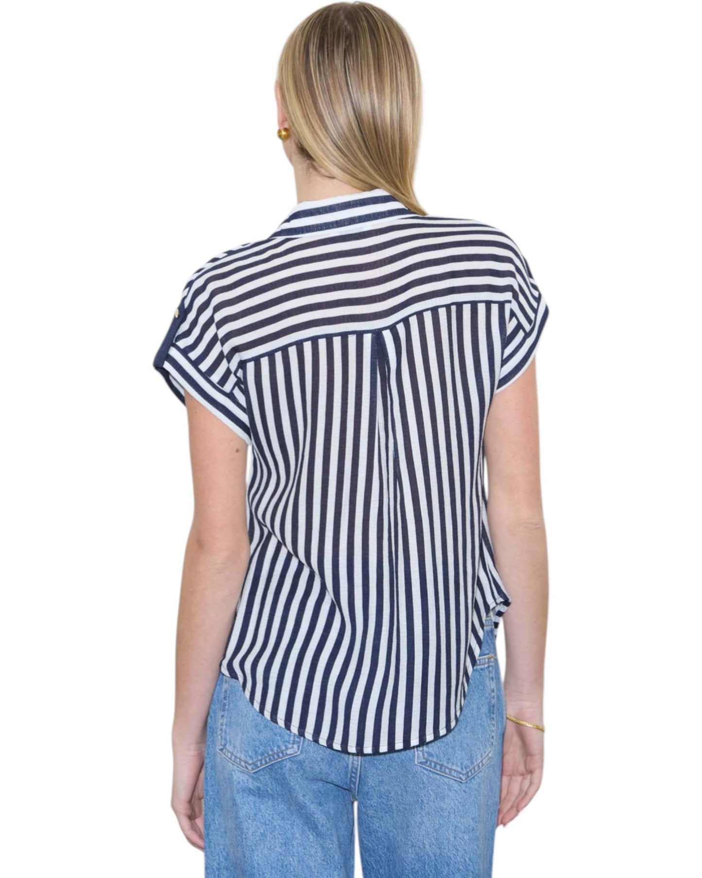 Person wearing a navy and white striped shirt with short sleeves on a white background