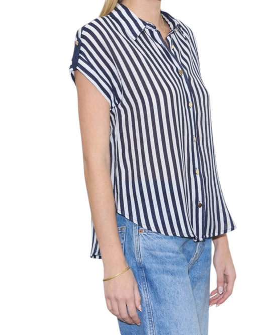Person wearing a navy and white striped shirt with short sleeves on a white background.