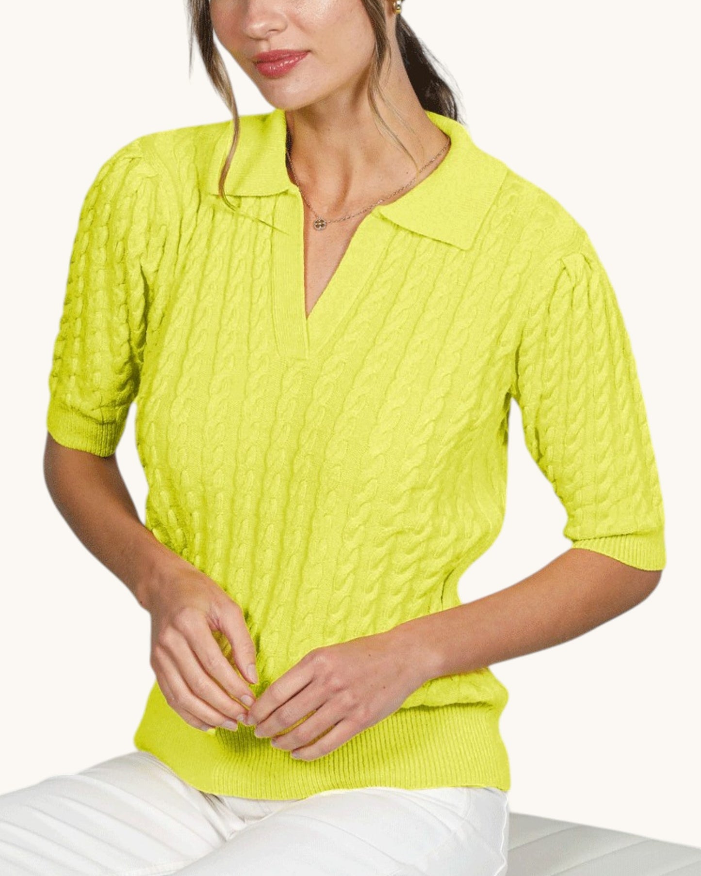 Neon yellow cable knit polo top with half puff sleeves and ribbed sleeve hem.