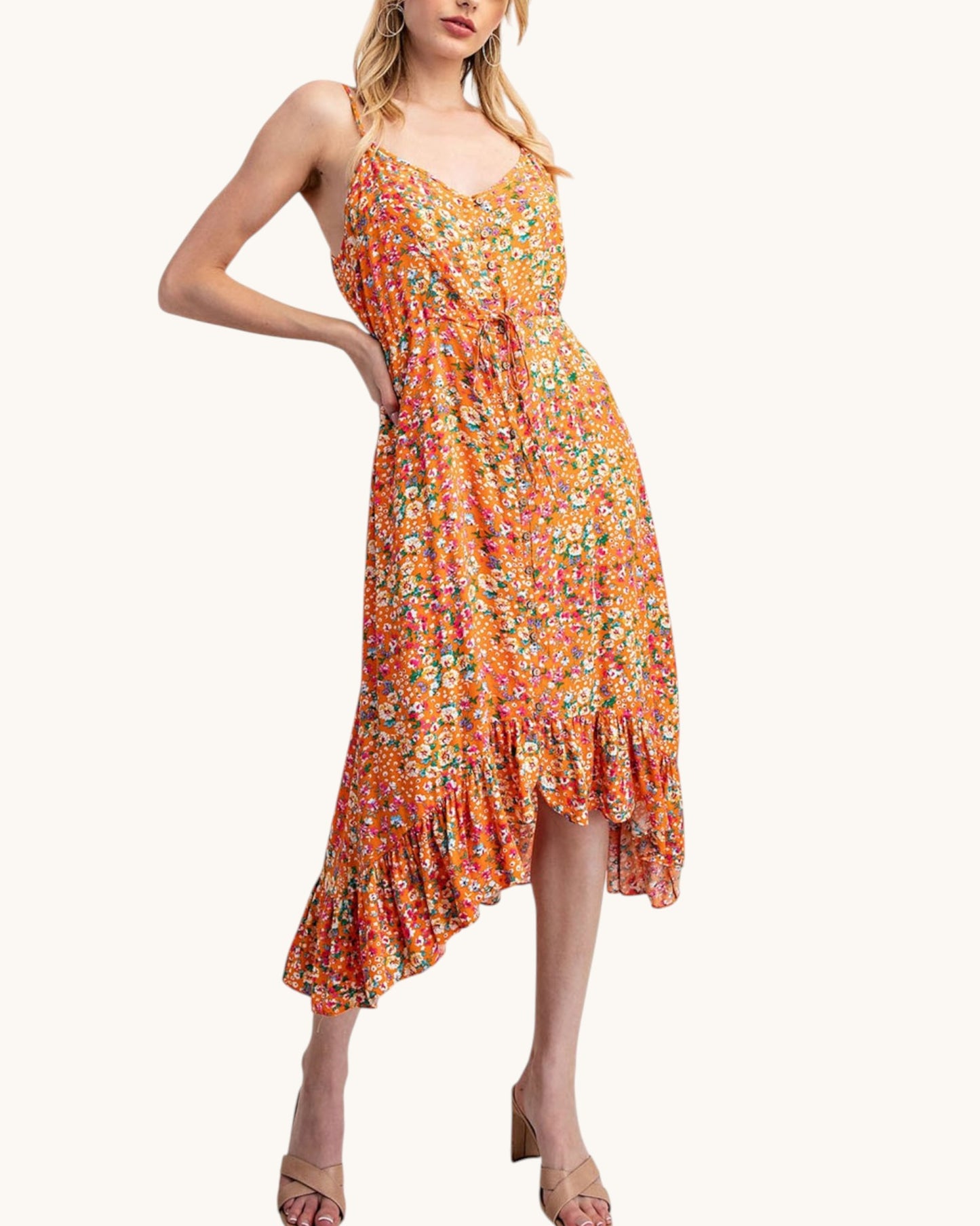 Floral and orange midi dress with bottom ruffle and spaghetti straps.