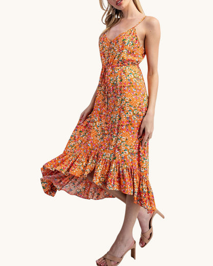 Floral and orange midi dress with bottom ruffle and spaghetti straps.