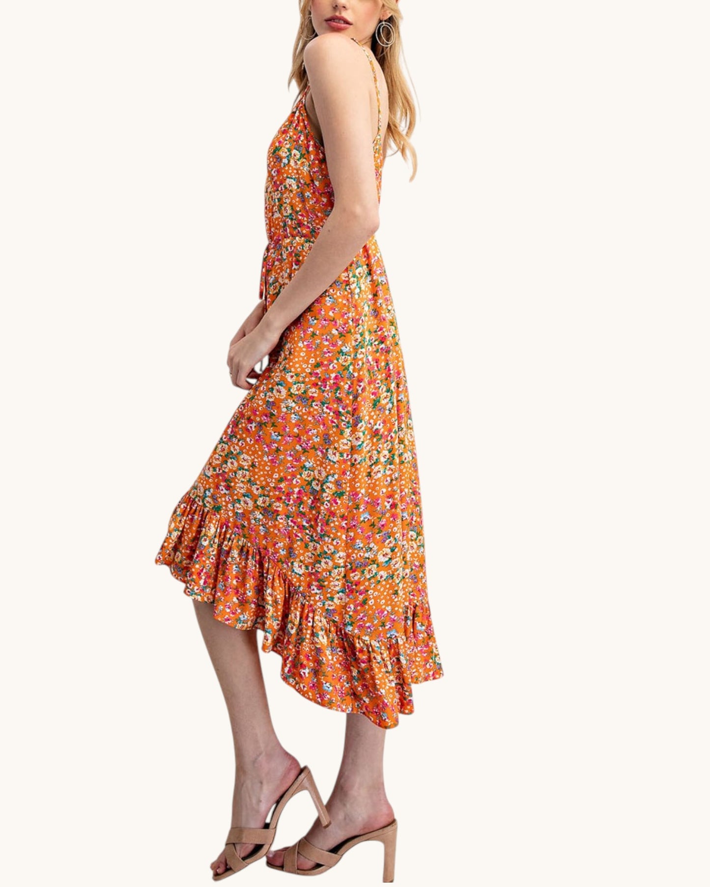 Floral and orange midi dress with bottom ruffle and spaghetti straps.
