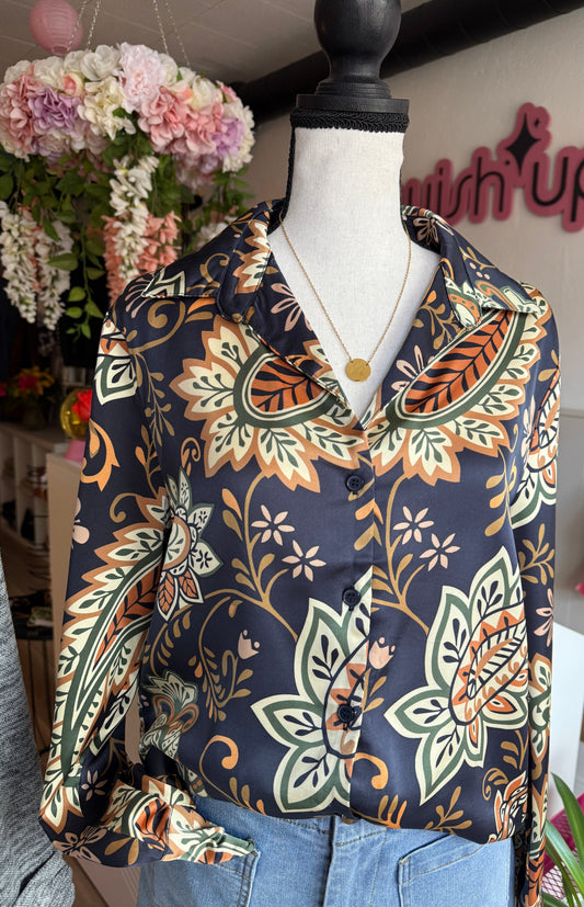 Navy long sleeve paisley print blouse on mannequin. 