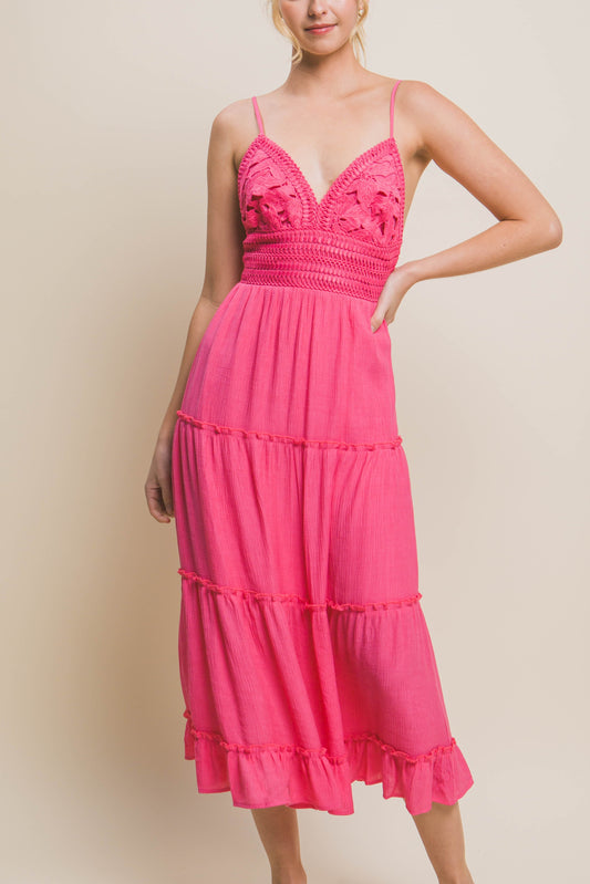 Hot pink crochet top maxi / midi length dress with adjustable straps, open tie-back, and tiered panels.