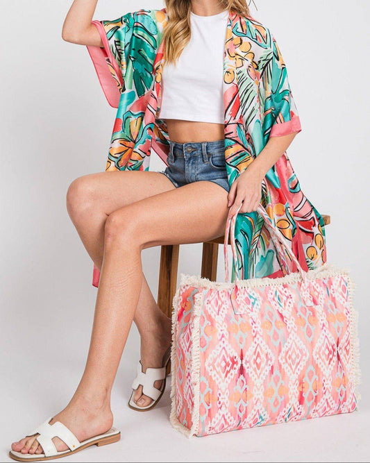 Coral and pink fringe boho beach tote with snap closure and soft fabric. 