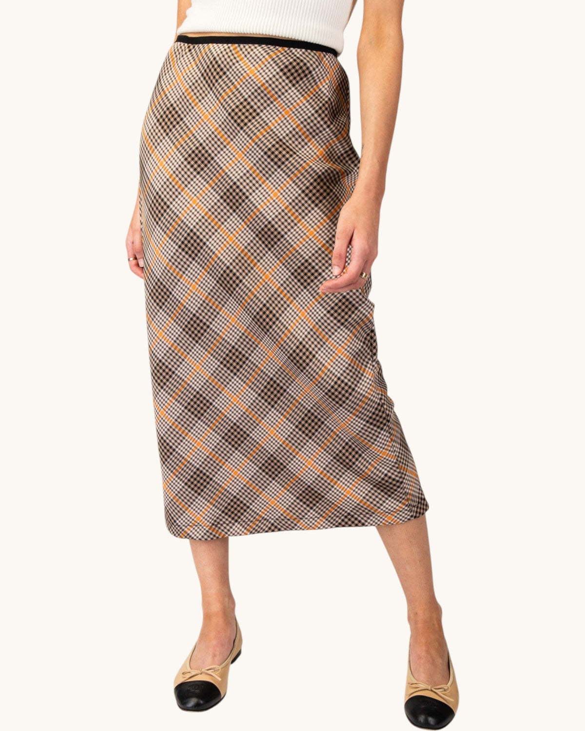 Brown, cream, and orange grid plaid midi pencil skirt front view.