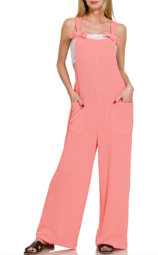 Peach corded rib overalls with adjustable knot straps and a relaxed fit. 