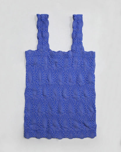 Blue floral textured tank top on a light gray background.